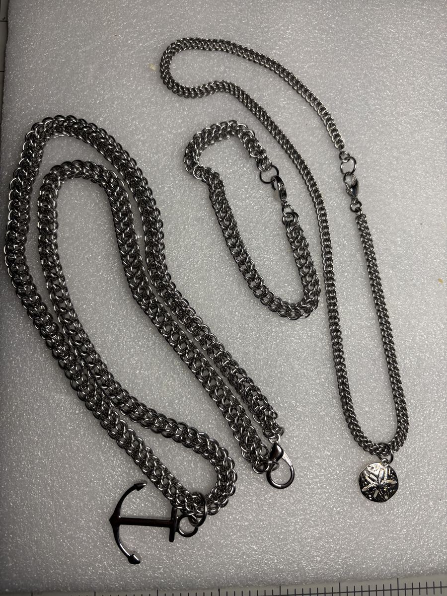 Dark steel chains with anchor and sand dollar charms